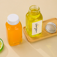2 onces Petite bouteille en verre Ginger Shot 60ml Bouteille de jus de fruit carrée transparente avec couvercle hermétique en plastique et aluminium Logo personnalisé