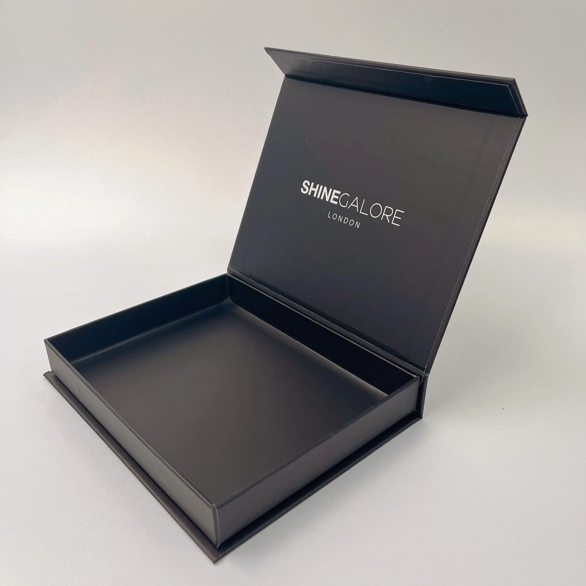 Luxury black rigid magnet closure gift boxes with white logo printing