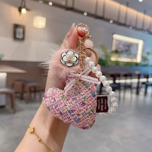 พวงกุญแจรถยนต์รักษ์โลก ดีไซน์สร้างสรรค์ ลายดอกคามิลเลีย ทอจากวัสดุธรรมชาติ พร้อมจี้ห้อยกระเป๋าผู้หญิงสุดหรู ตกแต่งด้วยผ้าทวีดรูปหัวใจ และพู่ขนสัตว์เทียม - Product Image 4