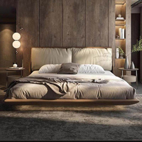 Lit king size minimaliste italien avec tête de lit capitonnée surdimensionnée, lit flottant luxueux rembourré pour chambre principale