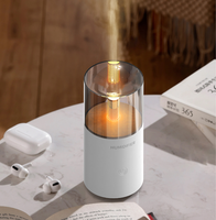 Diffuseur d'huiles essentielles créatif pour la maison HX129 noir et blanc, diffuseur d'air ultrasonique, machine à aromathérapie, mini humidificateur à lumière de bougie