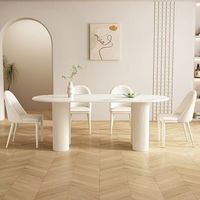 Ensemble de table à manger ovale minimaliste de luxe léger 6 places avec plateau en pierre frittée, pieds en bois et chaises à texture verticale (MDF)