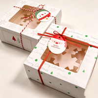 Boîte à gâteau en carton blanc festif et coloré, motif bonhomme de neige de Noël avec fenêtre découpée, pour présentation de pâtisserie de comptoir de fêtes