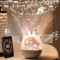 Cadeau de Noël, lampe de projection étoilée en forme de lapin mignon avec télécommande, boîte à musique, lumière d'ambiance romantique, veilleuse