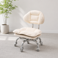 Chaise de salon minimaliste moderne avec dossier en métal, pivotante sur roulettes, fauteuil bas pour salon