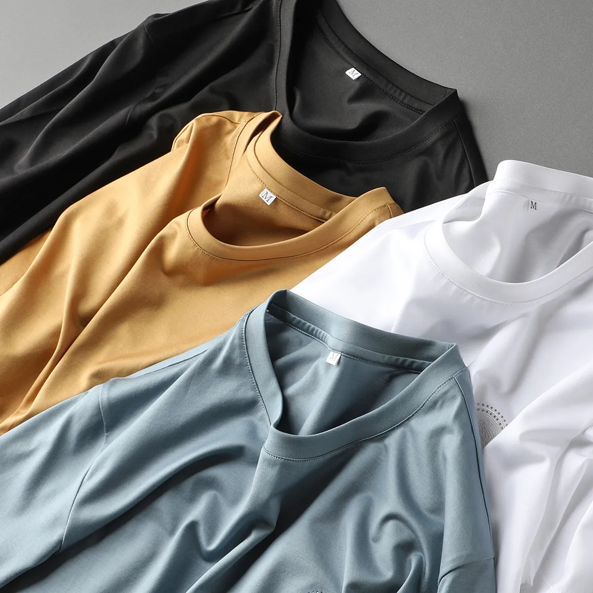 Camiseta holgada 100% de algodón para hombre, Logo personalizado con estampado de Camisa lisa, color negro, venta al por mayor