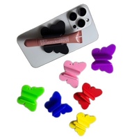 Support de téléphone multifonction en silicone à ventouse style papillon, support de rouge à lèvres anti-choc pour utilisation au lit, pour rouge à lèvres et brillant à lèvres