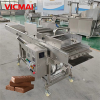 Machine à enrober le chocolat avec système de tempérage, pour une enrobage uniforme et automatique des gaufrettes, bonbons et biscuits