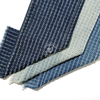 Tissus en denim crocheté bleu 70% coton 9,5 oz, perforés, avec positionnement de trous parallèles à espacement de 1 cm, traités, vente en gros