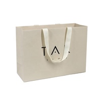Sac en papier d'emballage cosmétique de luxe en gros avec poignée torsadée robuste et logo personnalisé