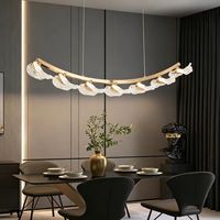 Lustre LED en cristal réglable avec système de suspension, finition dorée, intensité variable, garantie 3 ans, idéal pour salon et mariages