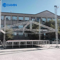Scène modulaire en alliage d'aluminium et contreplaqué, capacité de charge 700 kg, installation rapide, structure d'éclairage carrée, hauteur réglable