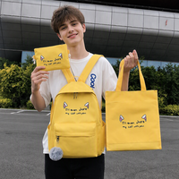 Nouvel ensemble de sacs d'école quatre pièces mode printemps-été pour étudiants, sac à dos imperméable à oreilles de chat grande capacité en nylon avec sac à bandoulière en maille