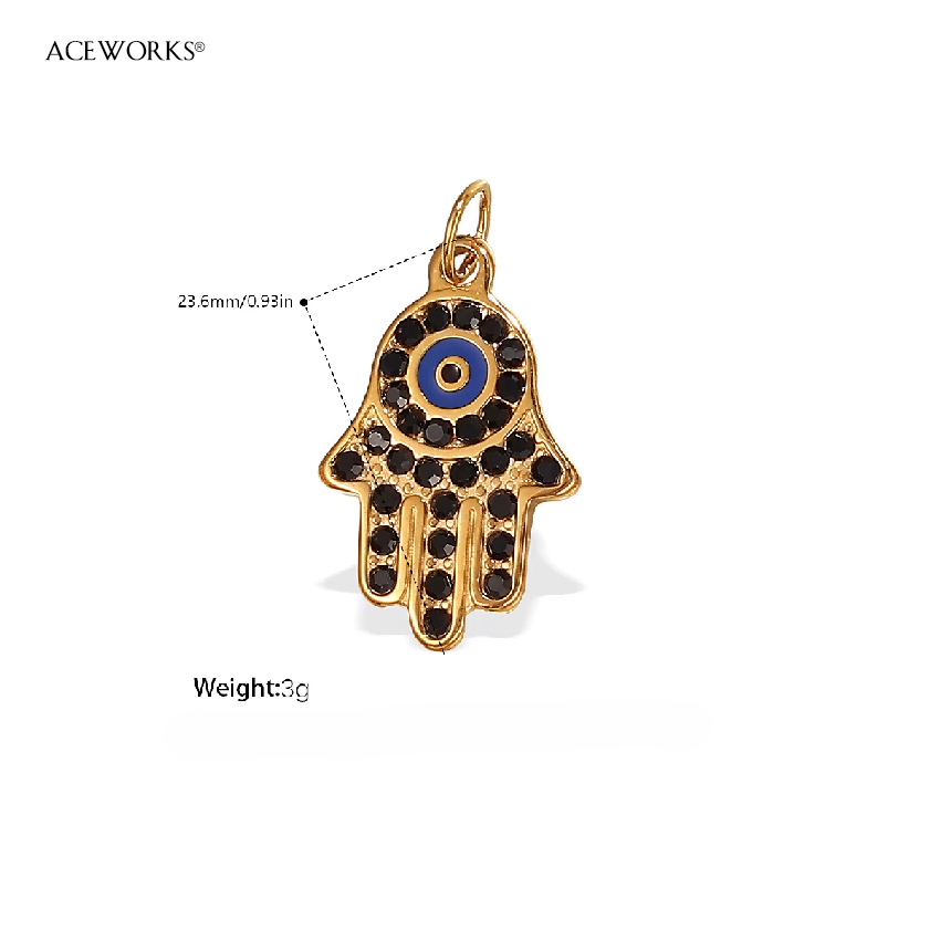 Hamsa pavée de spinelle noir avec mauvais œil bleu