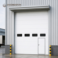 Puerta Seccional Industrial de Elevación Vertical, Paneles de Acero con Espuma de PU de 40 mm, Ventanas de Visión, Aislamiento Térmico, Operación Manual/Motorizada