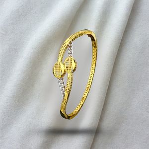 Gold Finish Designer Bangle with Interlinked Oval Motif and Textured Detailing Stylish Lightweight Jewelry <b>for</b> <b>Women</b> Perfect - Product Image 1