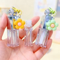Tube de brillant à lèvres transparent avec un grand applicateur en forme de fleur, 8 ml, en plastique rond, vide, avec porte-clés