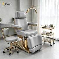 Table de massage électrique réglable pour salon de beauté avec base en métal pour usage hôtelier