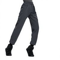 Pantalon de préchauffage de ballet pour femme adulte en nylon extensible dans les quatre sens, idéal pour la pratique de la danse et l'entraînement, favorisant la transpiration.