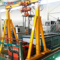 Grue portique mobile HNTIWIN certifiée CE, à roues en caoutchouc sans rail, capacité 5-10 tonnes, avec palan à chaîne, hauteur de levage 10m et garantie de 3 ans