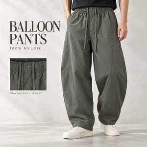 Pantalones Unisex de Nylon 100% Ligeros de Verano, Estilo Casual, Holgados, de Pierna Ancha, con Cintura Elástica y Cordón Ajustable, Costura Curva - Product Image 1