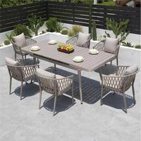Chaise de salle à manger moderne d'extérieur en aluminium empilable et imperméable avec coussin pour hôtel, idéale pour les villas, patios et restaurants