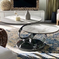 Meubles de maison d'hôtes modernes Cadre en acier inoxydable argenté rotatif Plateau rond en pierre frittée blanche Table basse