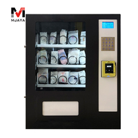 Distributeur automatique de mini-snacks, boissons et préservatifs avec accepteur de pièces, lecteur de billets et de cartes de crédit MDB/DEX