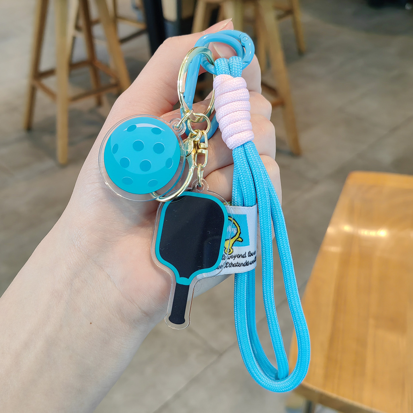 Light blue pickleball racket + light blue double string
