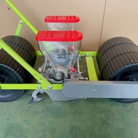 Machine à semer les graines Machine agricole propulsée à la main Vente en gros Machine à semer les légumes efficace