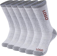 Chaussettes de sport en bambou à haute élasticité avec logo personnalisé OEM pour hommes et femmes Chaussettes de sport longues respirantes et rembourrées