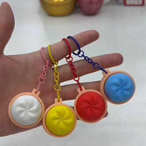 Wholesale Plastic Dumpling Press Button Colorful Seamed Bun Vending Decompression Keychain Capsule Toy - Product Image 1