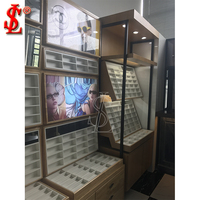 Support de lunettes de soleil de luxe avec éclairage LED pour l'aménagement intérieur des magasins d'optique dans les centres commerciaux