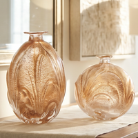Diffuseur d'arômes en verre de luxe moderne, soufflé à la main, avec des étincelles dorées et un corps rond sculptural, pour la décoration du salon