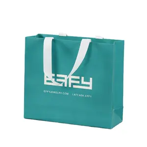 Sacolas de transporte para compras com logotipo estampado de luxo personalizado, sacolas de papel para compras com alça de fita, embalagens para lojas de roupas azuis personalizadas