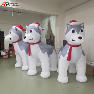 Noel şişme Husky köpek kırmızı şapka ile noel reklam için