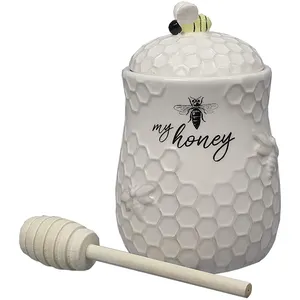 Damlatıcı ile toptan arı tasarım seramik bal kavanozu, toptan sevimli arı tasarım seramik bal kavanozu kepçe ve kapak ile