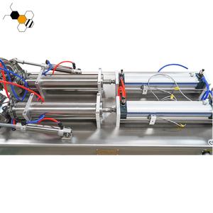 Máquina de llenado de miel de 2 boquillas semiautomática Máquina de llenado de botellas gruesas de pasta semiautomática neumática para líquidos - Product Image 3