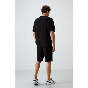 ชุดกางเกงขาสั้นผู้ชายทรงโอเวอร์ไซส์ผ้าฝ้ายสีดำ 100% ผ้าฝ้ายเนื้อพื้นฐาน รุ่น 85249 - Product Image 1