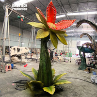 Énorme modèle de plante préhistorique animatronique pour parc aquatique ou exposition interactive de fleurs robotiques de style jurassique qui crachent de l'eau et de la fumée
