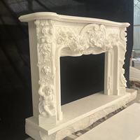 Cheminée décorative d'intérieur en marbre blanc de style européen et français avec sculptures rondes faites à la main