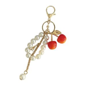 Llavero al por mayor con dije de flor de cerezo y perlas, llavero de cerezo personalizado con diamantes de imitación brillantes para accesorios de bolso - Product Image 6