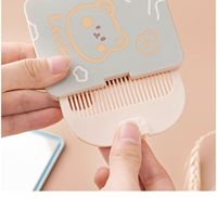 Cermin rias Mini Portabel 2 dalam 1, cermin lipat genggam, cermin rumah tangga kecil dengan sisir