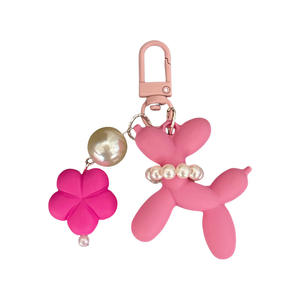 Globo de dibujos animados perro llavero Kawaii colorido suave Pvc auricular caso bolsa encanto accesorios encantador flor perro globo llavero - Product Image 1