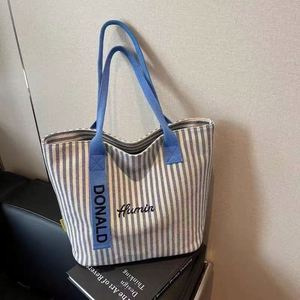 Bolso Tote de Lona a Rayas, Unisex, con Cierre de Cremallera, Gran Capacidad, Estilo Coreano, de un Solo Hombro, Venta al Por Mayor - Product Image 1