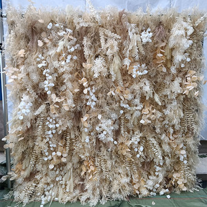 Wholesale silk fake pampas wall tile fabric cloth base rolling up pampas curtain plastic flower wall for wedding party decor