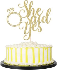 1 Pieza Decoración para Pastel con la Frase "Él pregunta, ella dice sí" - Divertida para Bodas, Compromisos, Despedidas de Soltera, Decoración para Fiestas (Dorado) - Product Image 1