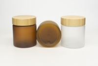 Vente en gros de pots en plastique PET transparent ambré givré naturel de 150 ml, 250 ml, 500 ml, nouveau produit, pour beurre corporel, crème cosmétique, avec couvercle en bambou