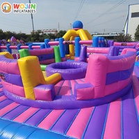 Parc d'aventure gonflable coloré style fête foraine, en PVC robuste et durable, pour un business de location à fort retour sur investissement, avec château gonflable