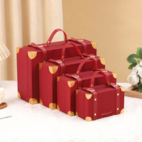 Boîte de cadeau décorative en papier fait main en cuir boîte en carton de luxe bébé tissu jouet valise boîte d'emballage cadeau avec poignée